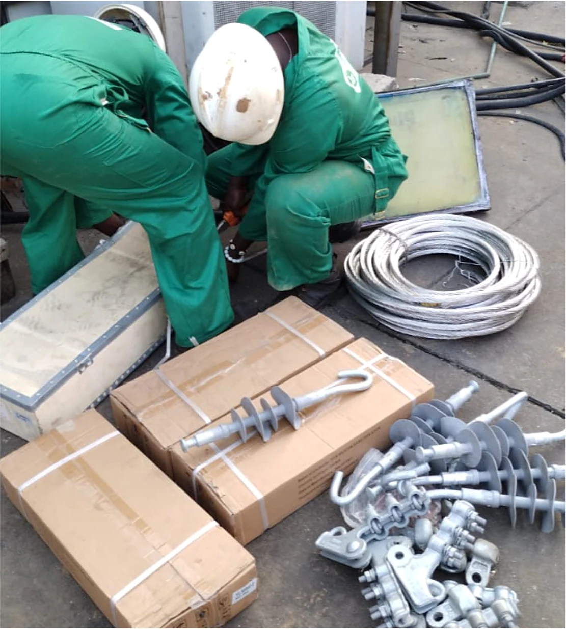 Ionir engineers preparing HV insulators and fittings before installation